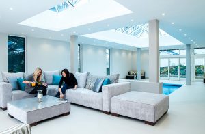 Women on couch under Lantern Roofs