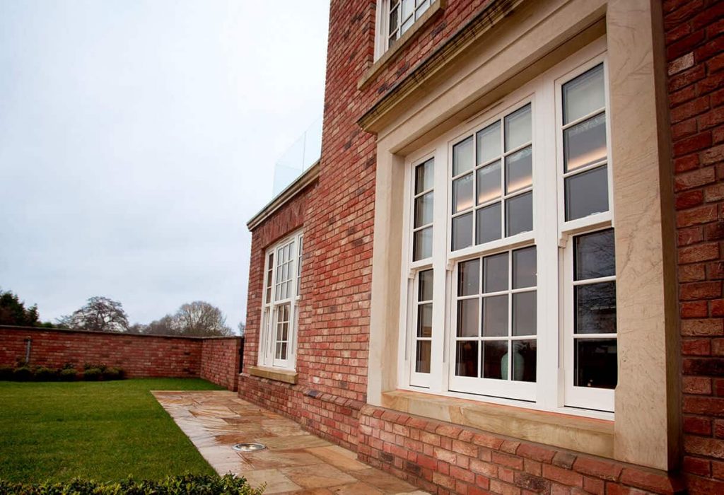 Large white uPVC vertical sliders