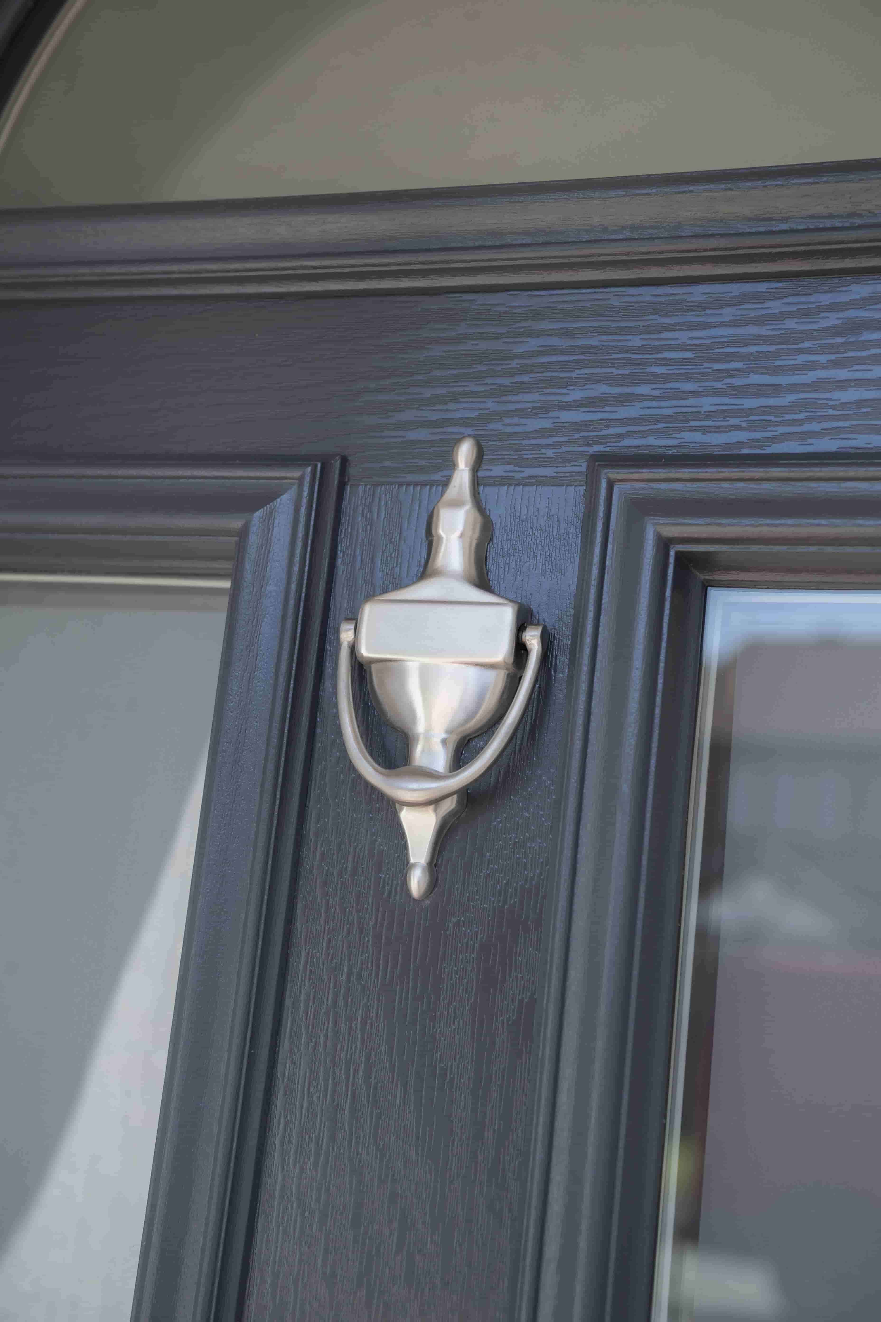Close up of Residor composite black front door with knocker