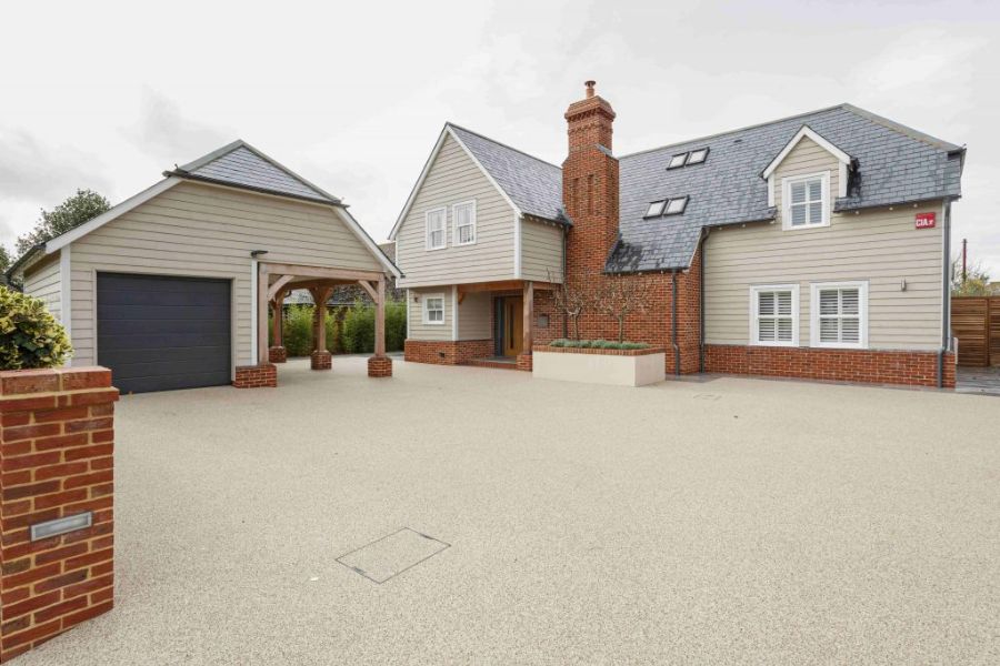 Modern detached home with Bereco timber windows featuring white-painted frames, gable windows, and plantation shutters.